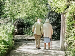 man and woman walking on road during daytime